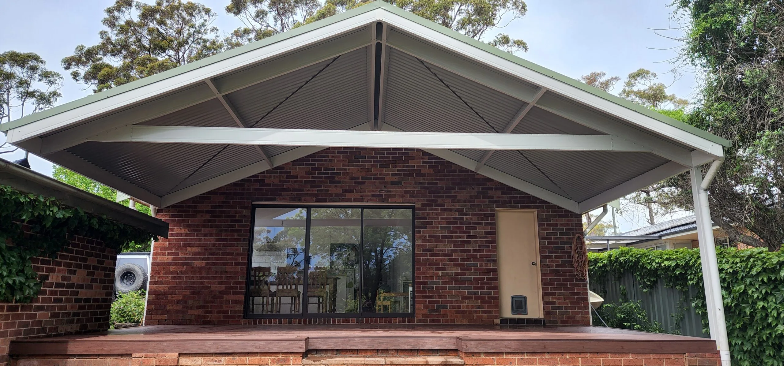 An Arcwood-built covered outdoor area connecting with the existing home